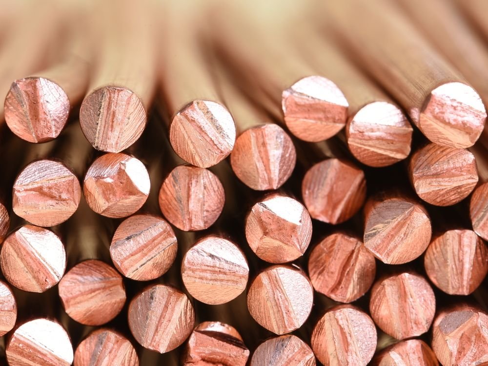 A close up of a stack of copper wire, manufactured for use in electric power cables.